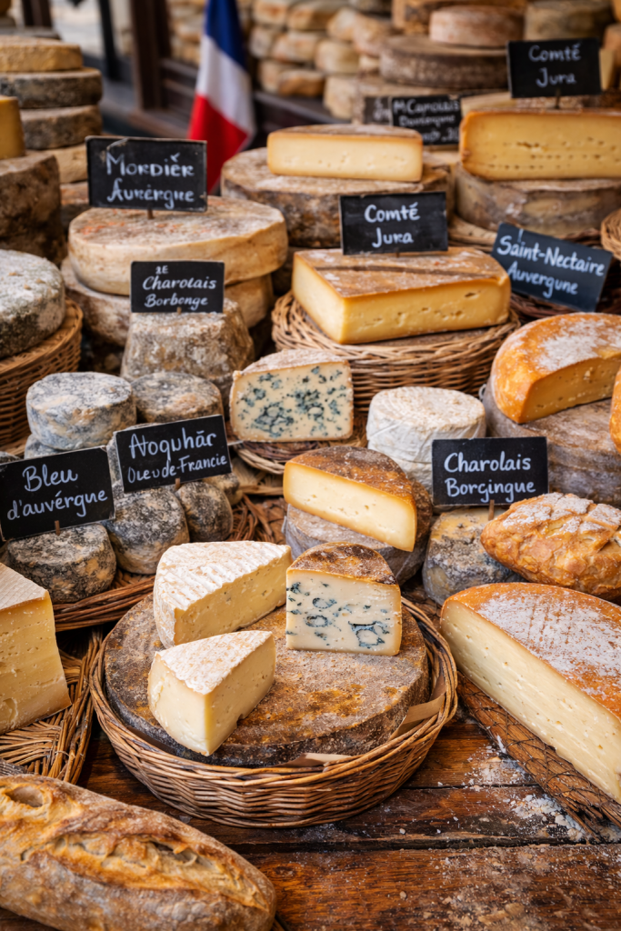 French cheese varieties displayed at a local market
