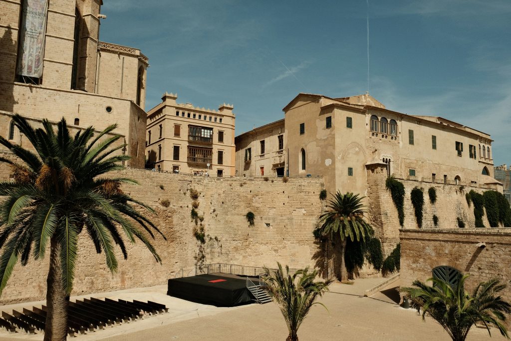 Palma de Mallorca skyline with La Seu Cathedral overlooking the Mediterranean Sea under clear blue sky