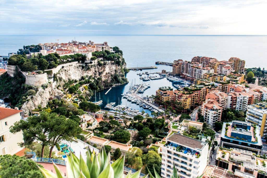 Monaco cityscape with yachts, marina and luxury buildings