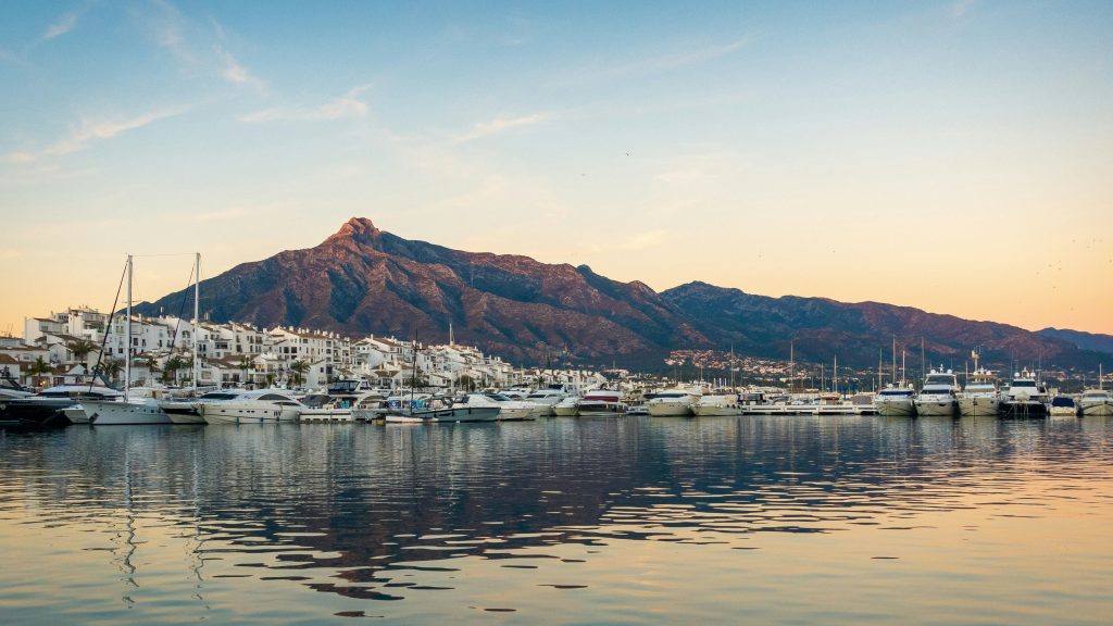 Marbella old town streets with white buildings and palm-lined coastal promenade on the Costa del Sol