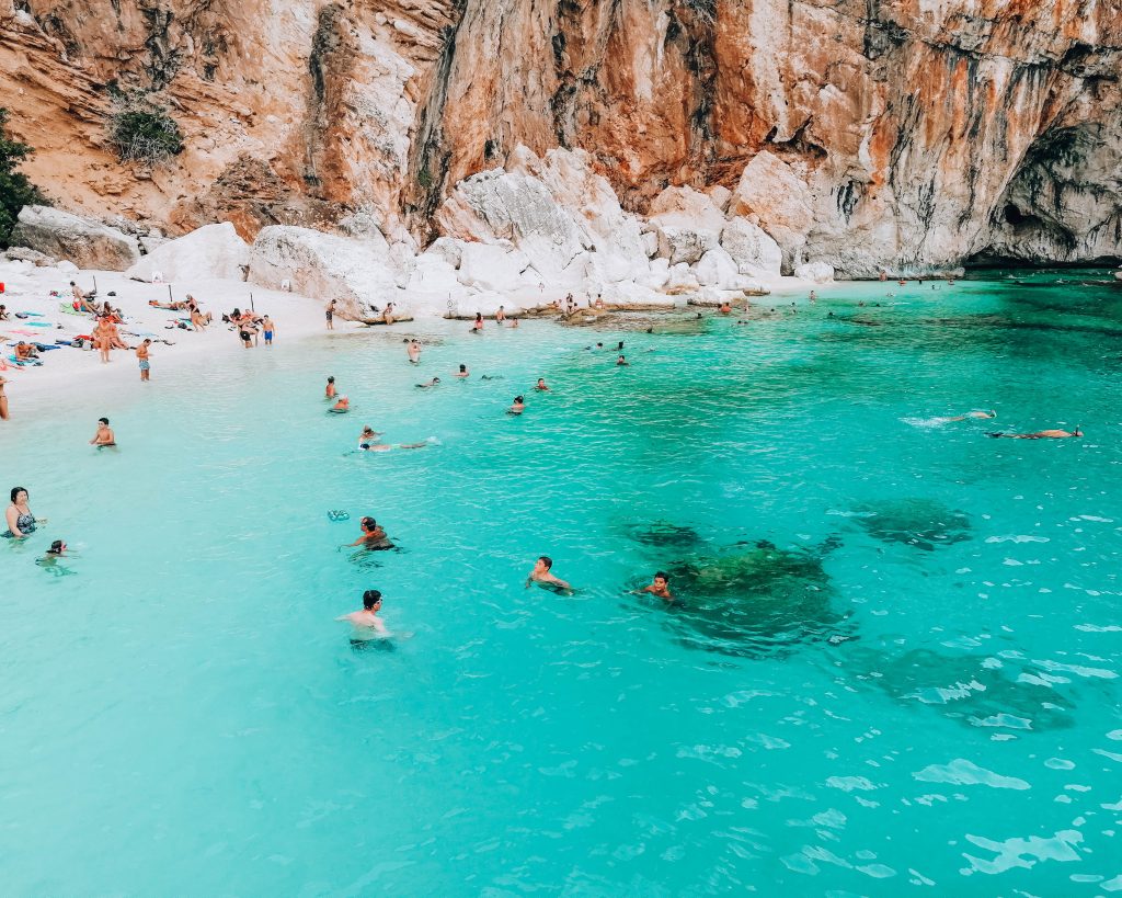 Aerial view of the wild and pristine coastline of Golfo di Orosei, East Sardinia, Italy, known for its turquoise bays and white marble cliffs.