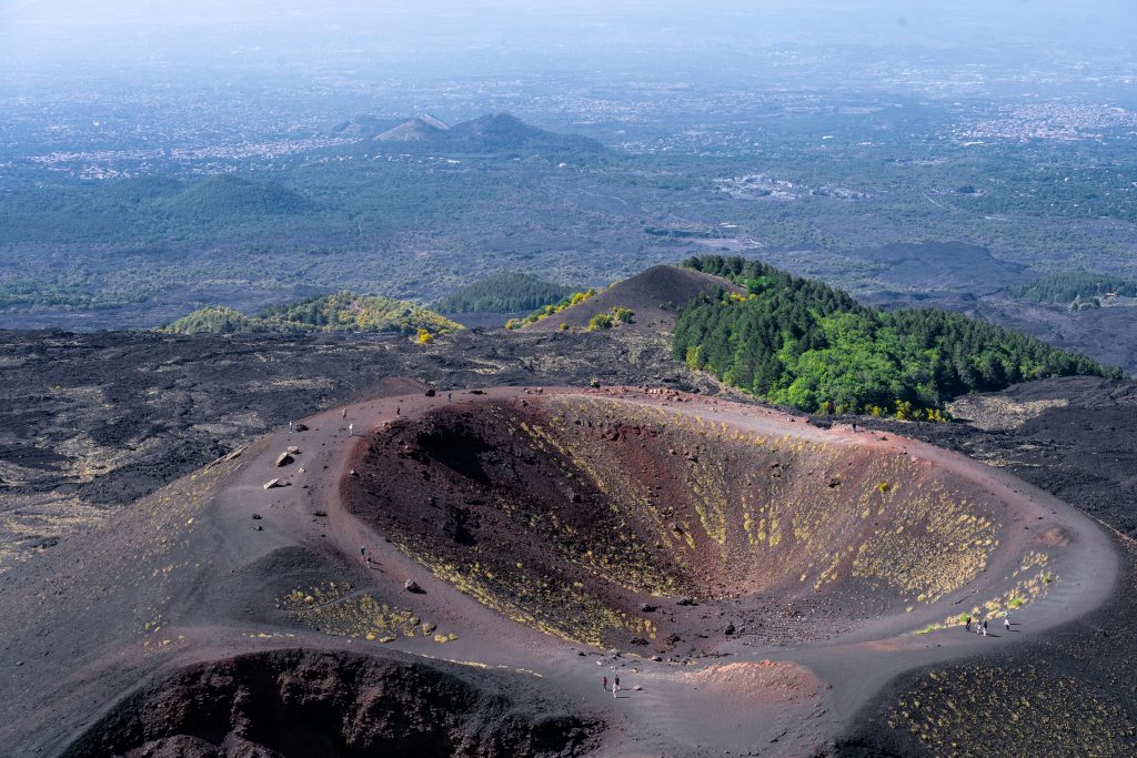 Mount Etna active volcano in Sicily with lava fields, craters, and dramatic volcanic landscape overlooking the Mediterranean Sea