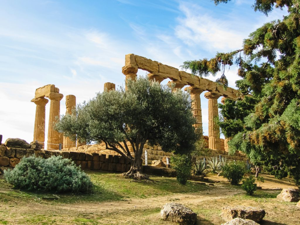 Agrigento ruins in Sicily showcasing the Valley of the Temples with well-preserved ancient Greek columns, stone pathways, and historic structures overlooking the Mediterranean landscape