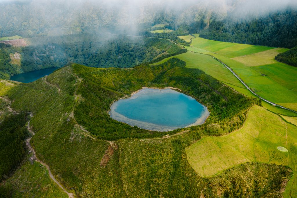 Azores volcanic islands landscape with crater lakes, green hills, and dramatic Atlantic coastline