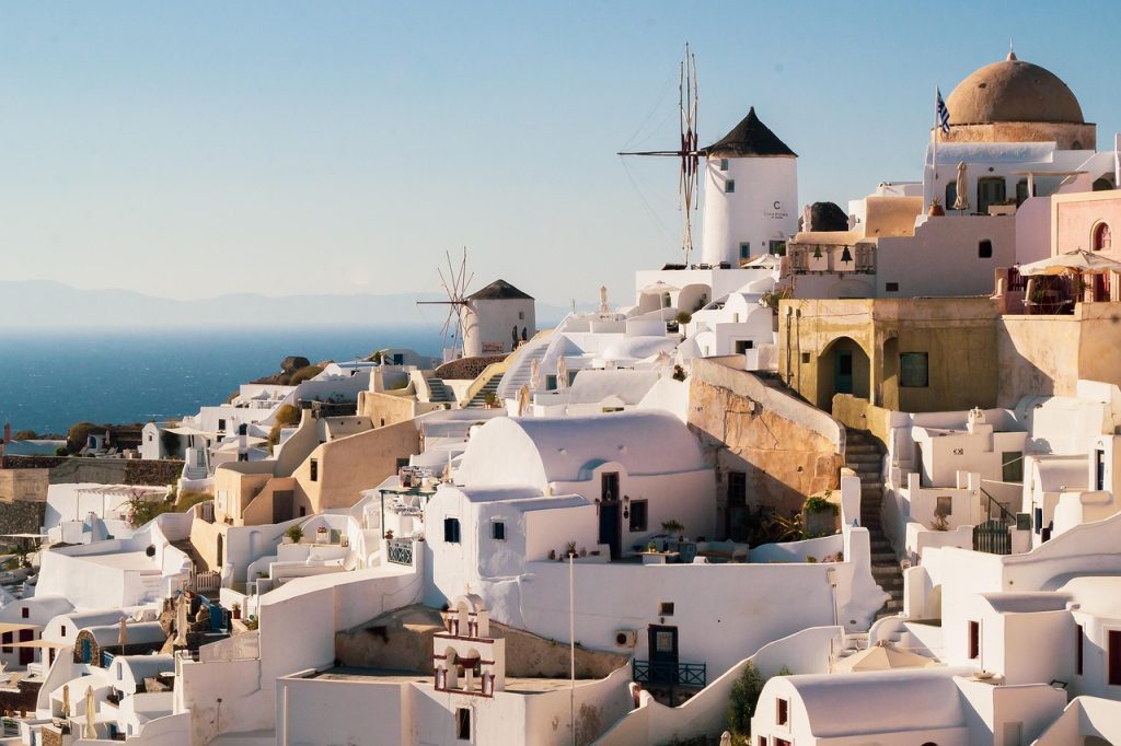 Santorini white houses on volcanic cliffs overlooking the Aegean Sea