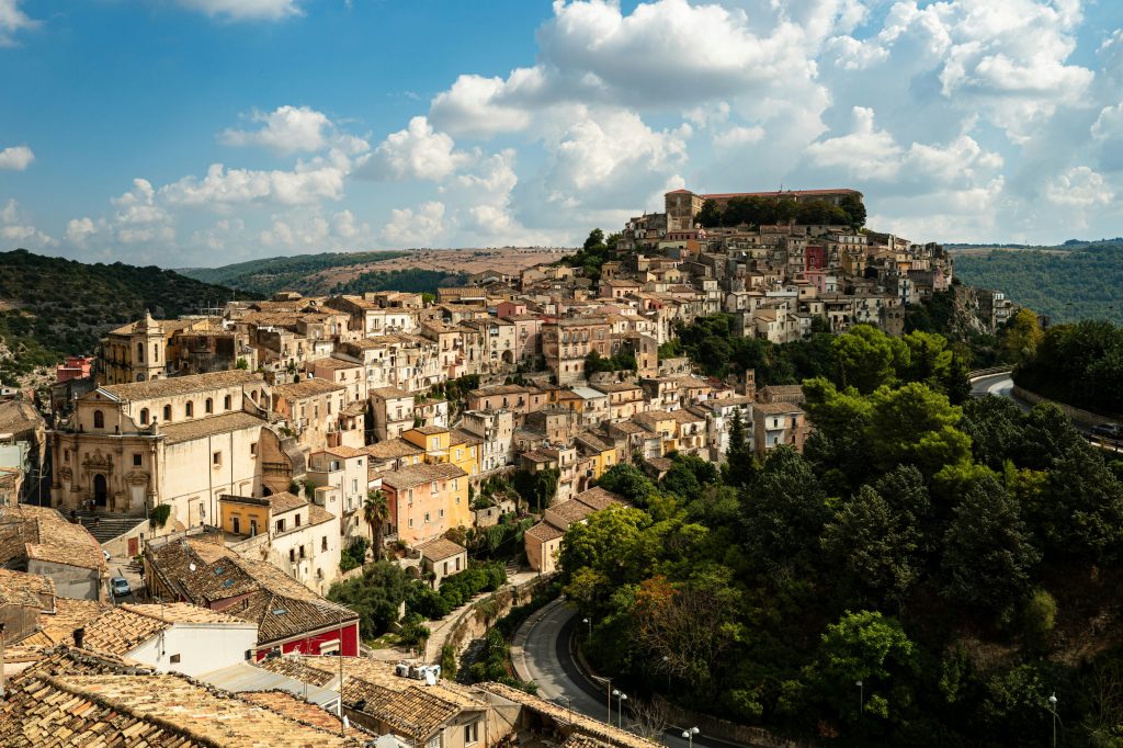 Baroque towns of Noto, Modica, and Ragusa showcasing ornate stone architecture, historic streets, and classic Sicilian baroque cityscapes under Mediterranean light