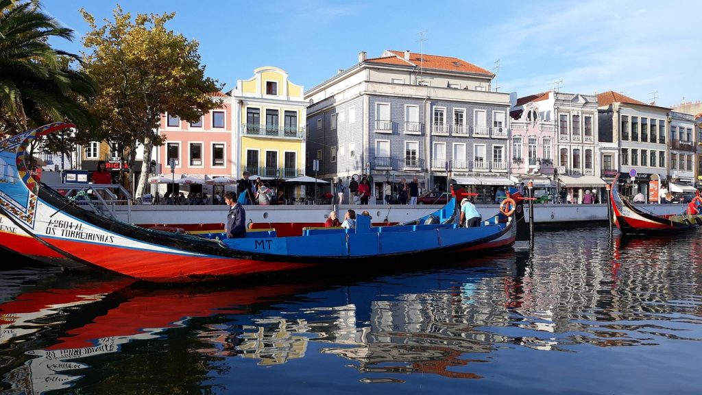 Aveiro canals with colorful moliceiro boats and traditional buildings, often called the Portuguese Venice