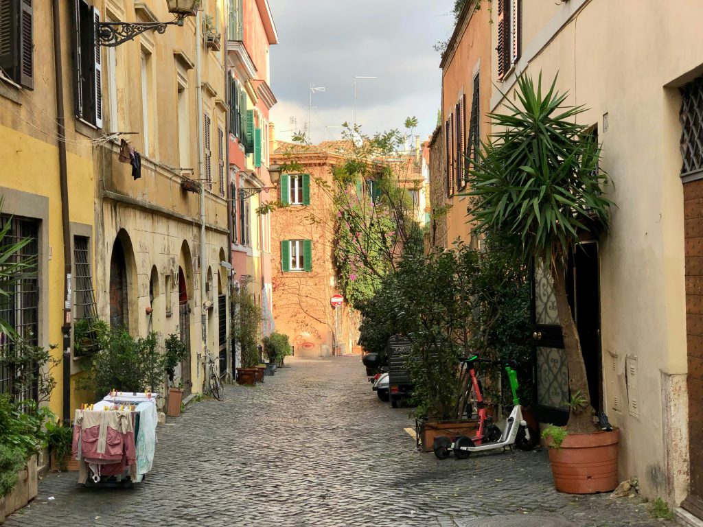 Trastevere neighborhood in Rome with cobblestone streets, historic buildings, and vibrant local atmosphere