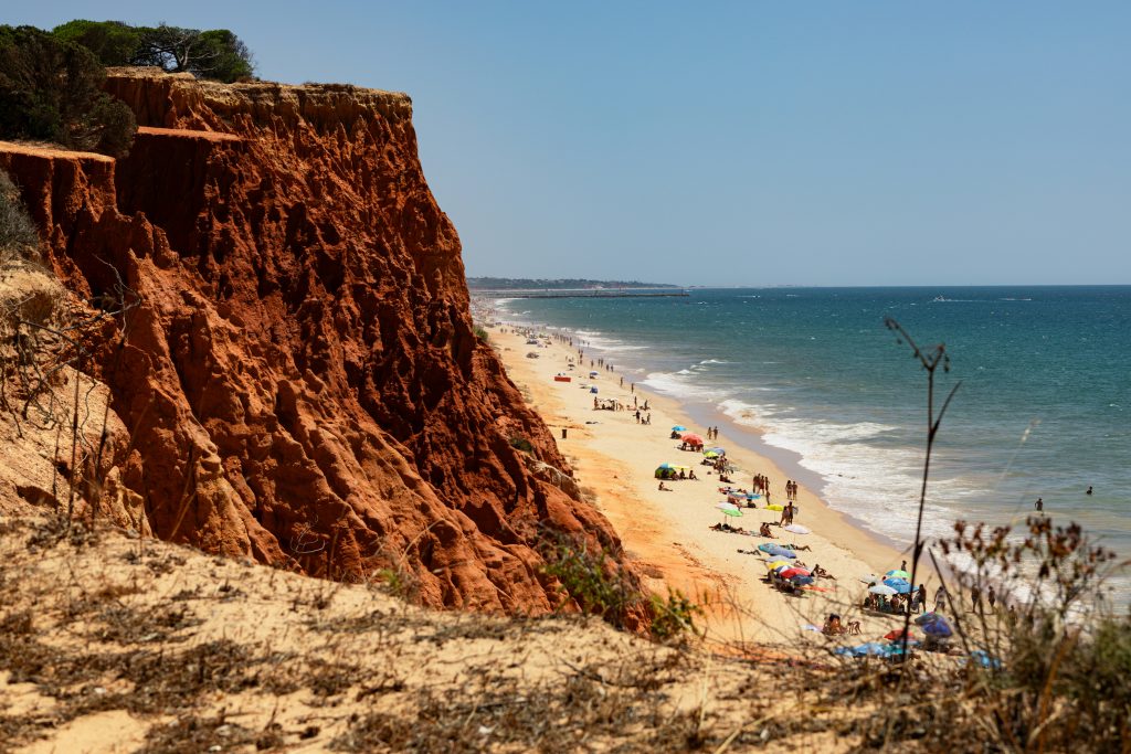 Praia da Falésia beach in Algarve backed by red sandstone cliffs