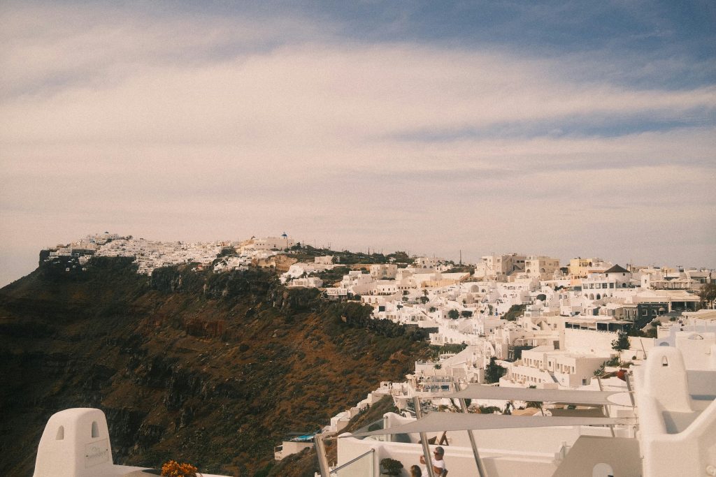 Fira town in Santorini with caldera views, white buildings and cliffside terraces above the Aegean Sea