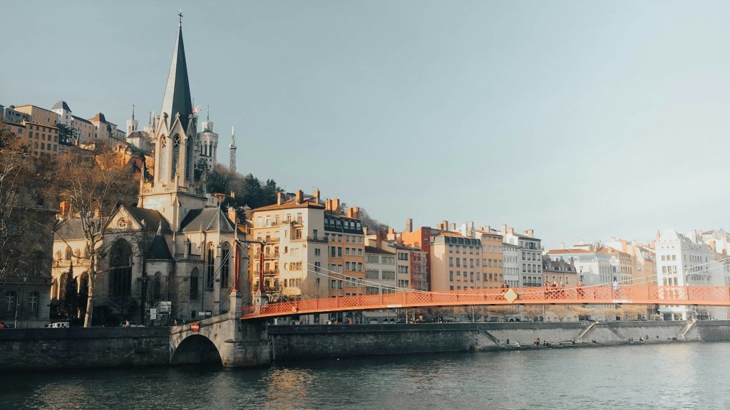 Lyon city skyline with Fourvière Basilica and Saône river at sunset