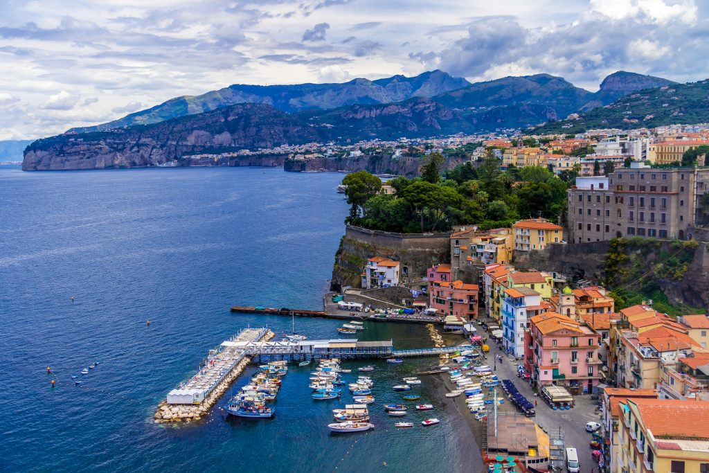 Cliffside town of Sorrento overlooking the Bay of Naples, with coastal views, colorful buildings, and Mediterranean atmosphere.