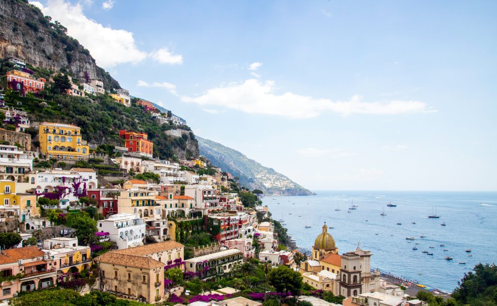 Positano cliffside village with colorful houses cascading down steep cliffs toward the Mediterranean Sea