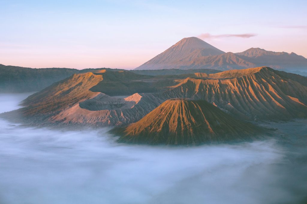 Mount Etna active volcano in Sicily with lava fields, craters, and dramatic volcanic landscape overlooking the Mediterranean Sea