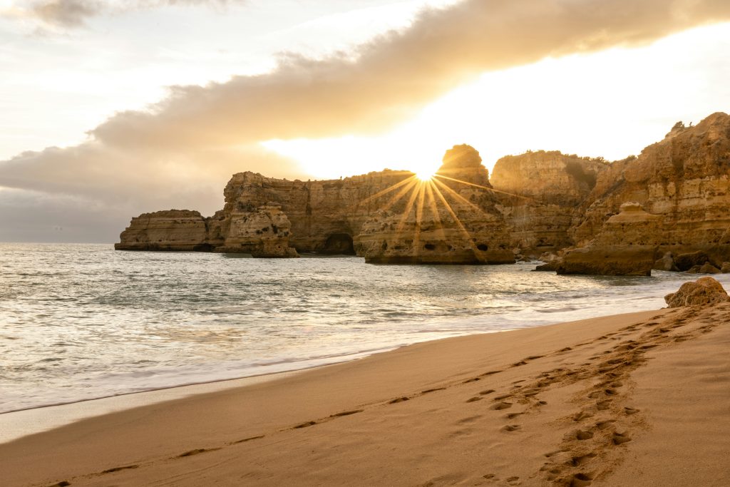 Praia da Marinha in Algarve Portugal with golden limestone cliffs and rock arches