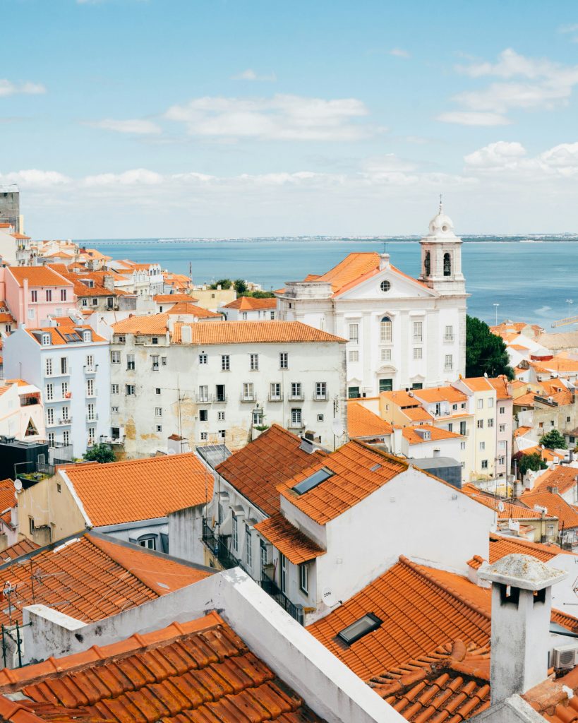 Historic Alfama district in Lisbon with narrow cobblestone streets and tiled houses