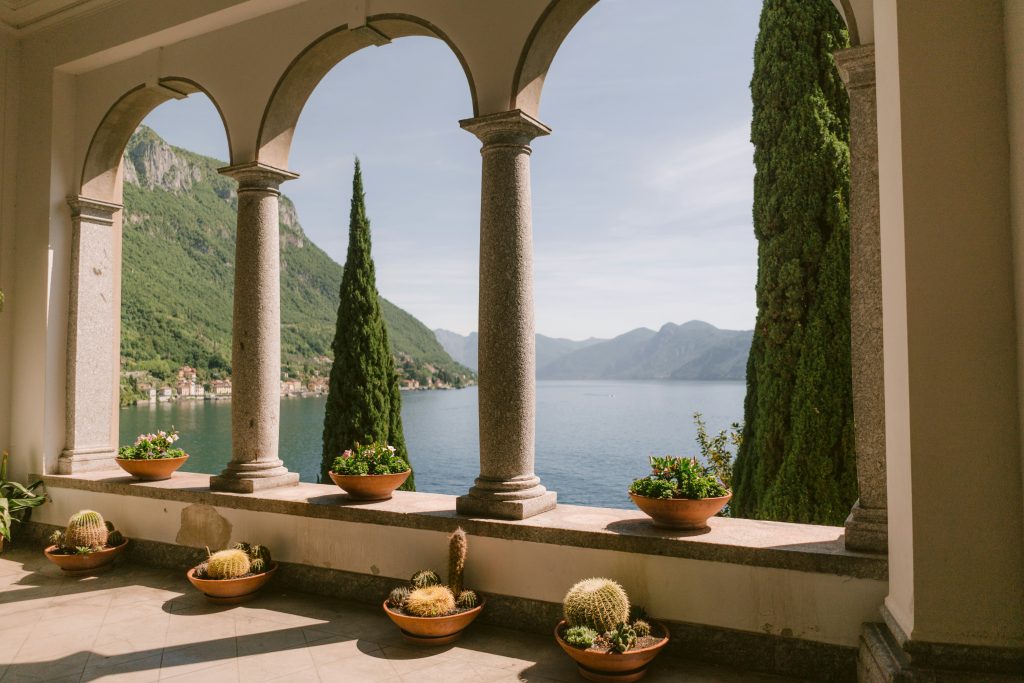 Lake Como surrounded by mountains, luxury villas, and calm waters in northern Italy
