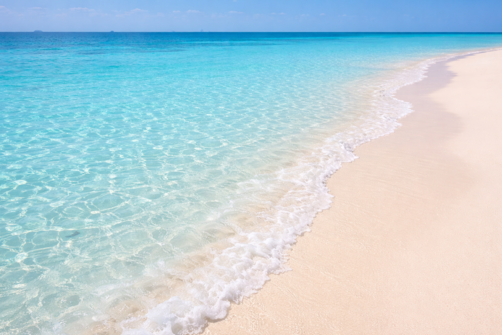 Bahamas Travel Guide tropical beach with crystal clear turquoise water and powdery white sand