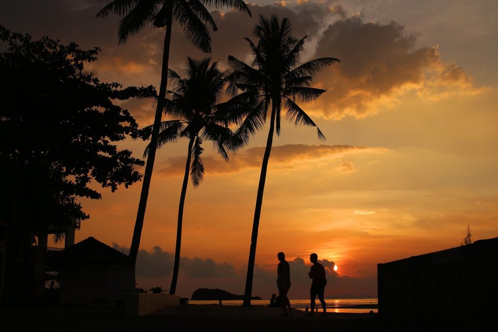 Koh Lanta Thailand quiet tropical beach with palm trees and sunset view