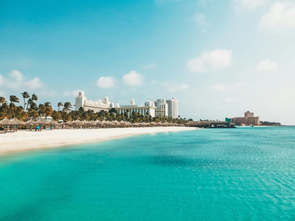 Aruba Travel Guide Palm Beach resort area with white sand beach turquoise water and luxury hotels
