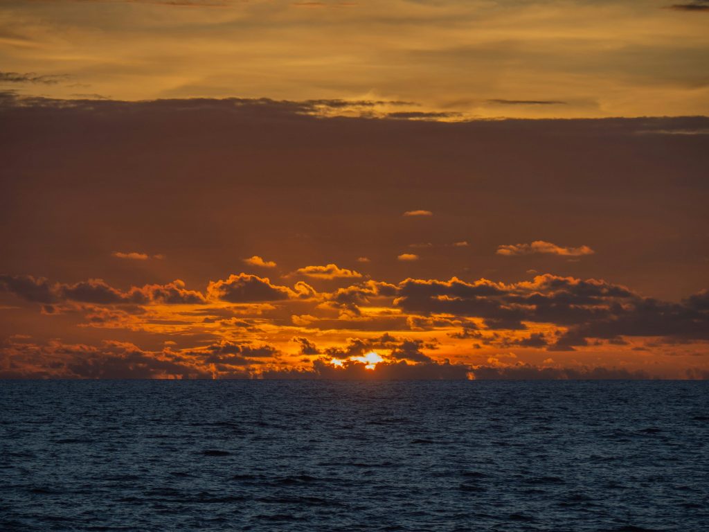 Bali travel guide beach club in Bali with pool, sunset, and tropical atmosphere