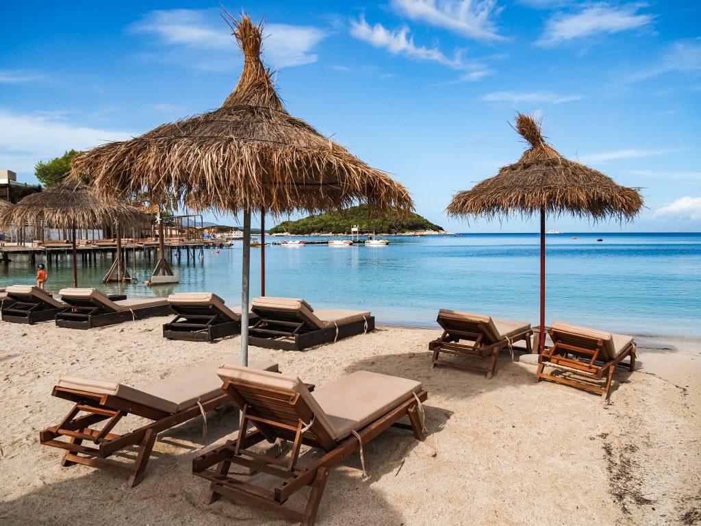 Ksamil Beach Albania clear turquoise water white sand central beach area with islands