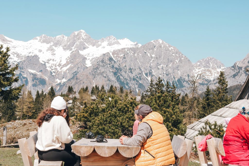 Velika Planina Slovenia summer green plateau traditional huts scenic mountain view