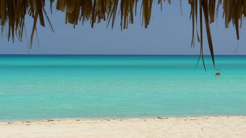 Palm trees and white sand beach at Playa Ancon near Trinidad Cuba travel guide