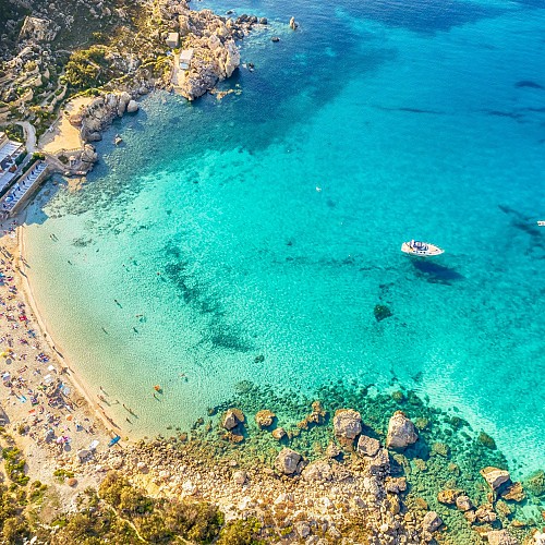 Malta travel guide Mellieha Bay sandy beach shallow water family friendly Malta coast