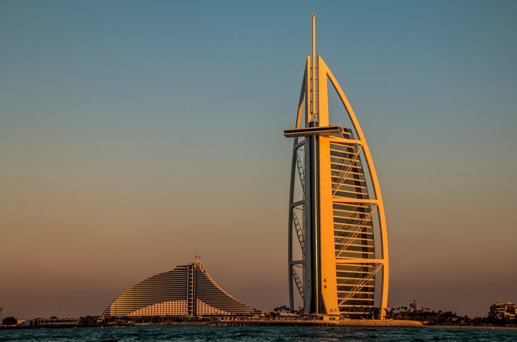 Sunset Beach in Dubai with Burj Al Arab view and ocean at sunset
