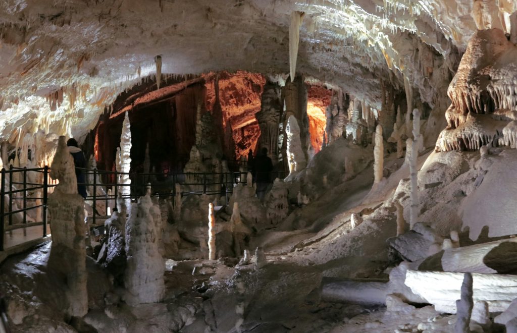 Postojna Cave Slovenia interior large chamber illuminated cave formations