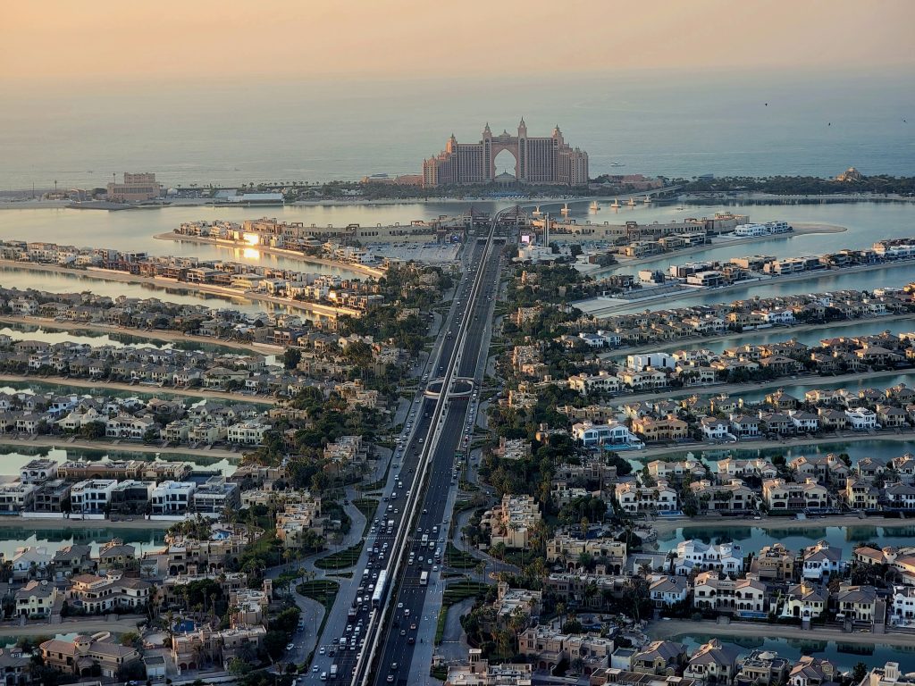 Dubai travel guide Palm Jumeirah aerial view with luxury resorts and island shape