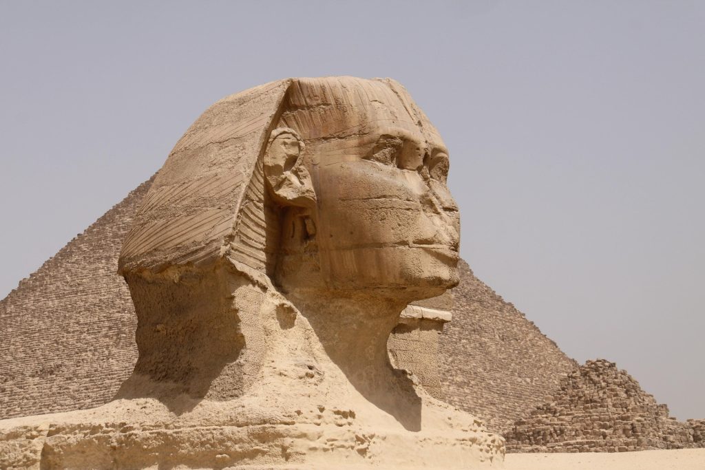 Great Sphinx of Giza with pyramids in the background, Egypt landmark travel destination