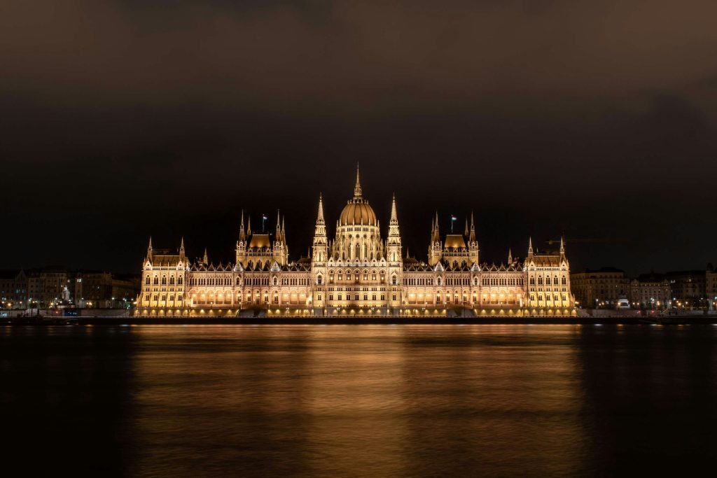 illuminated Parliament building at night in Budapest