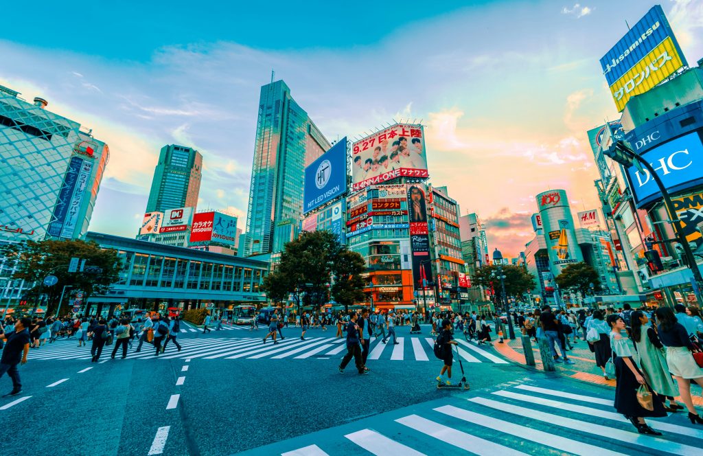 People crossing Shibuya Crossing in Tokyo with busy city atmosphere – Tokyo travel guide
