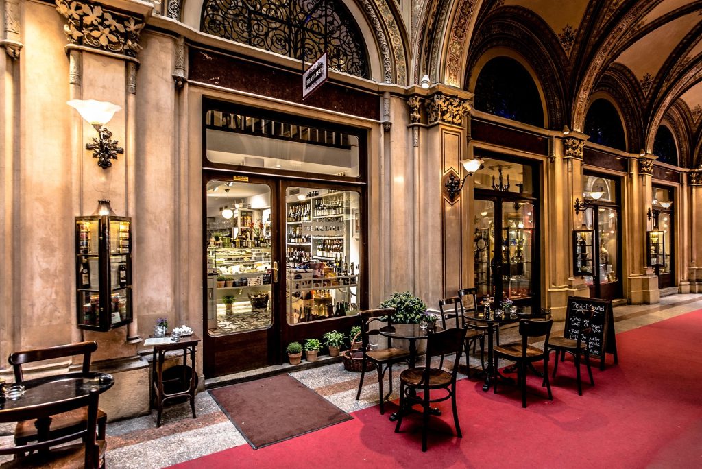 traditional Vienna café interior with coffee and dessert on table