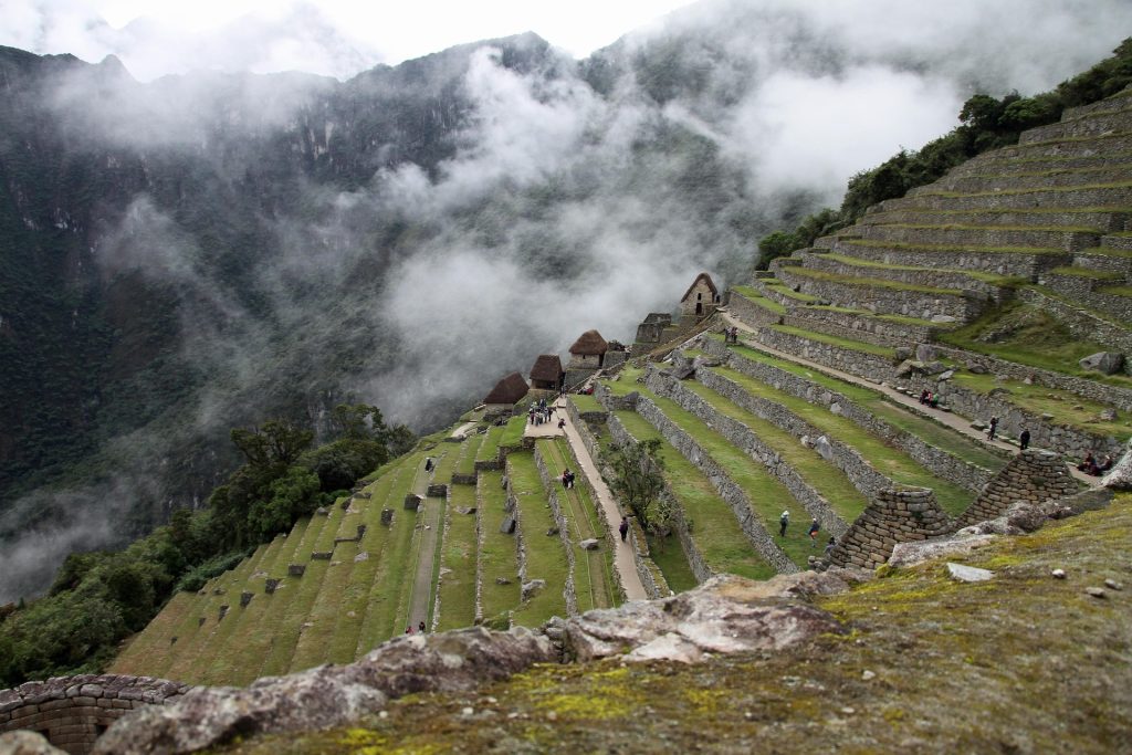 Hikers walking along a mountain trail in the Andes Peru