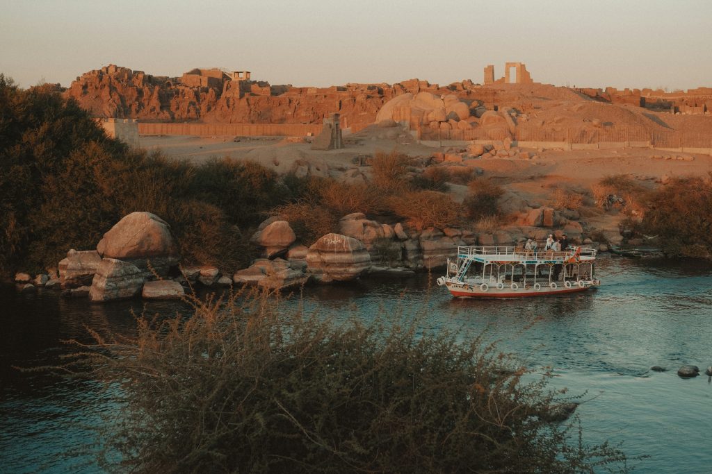Sunset over the Nile River in Egypt with boats and historic surroundings