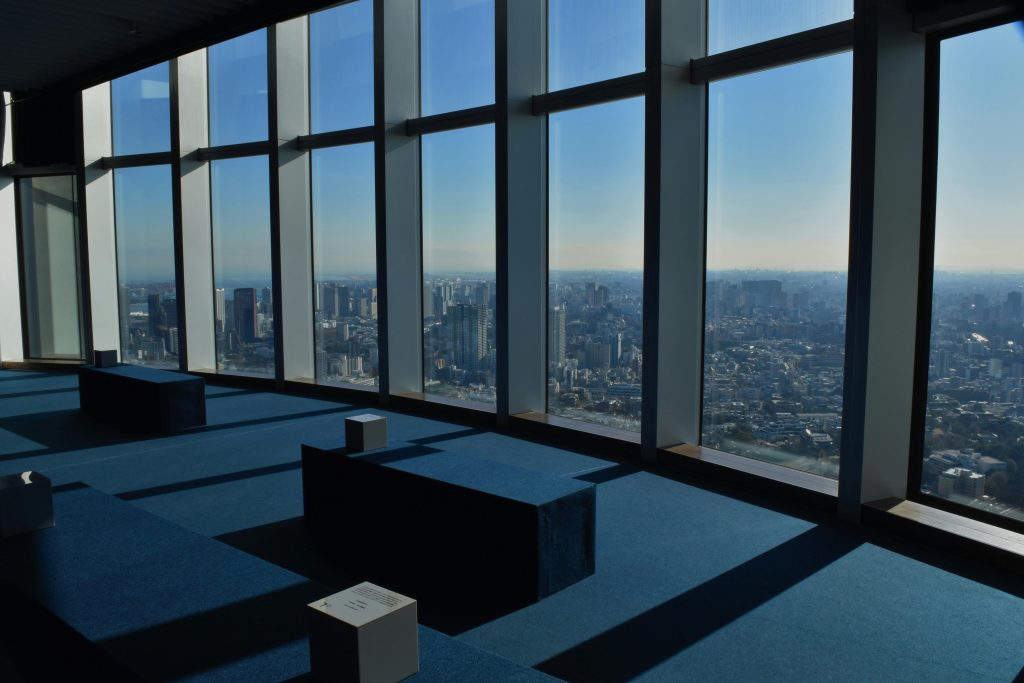 Tokyo city view from observation deck with skyline and buildings – Tokyo travel guide