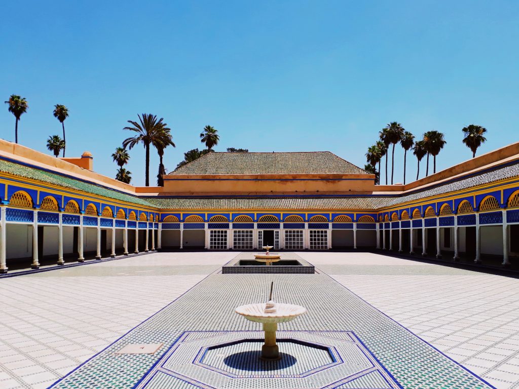 Traditional courtyard with fountain and palm trees