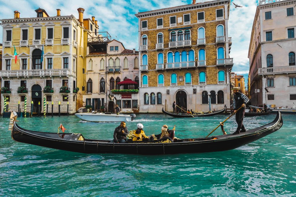 Gondola ride on the Grand Canal in Venice, surrounded by historic Venetian buildings