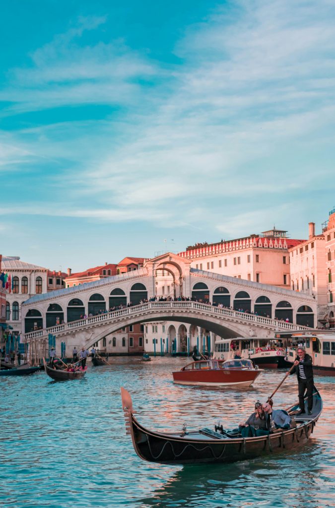 Gondola on the Grand Canal with Rialto Bridge in Venice, Italy