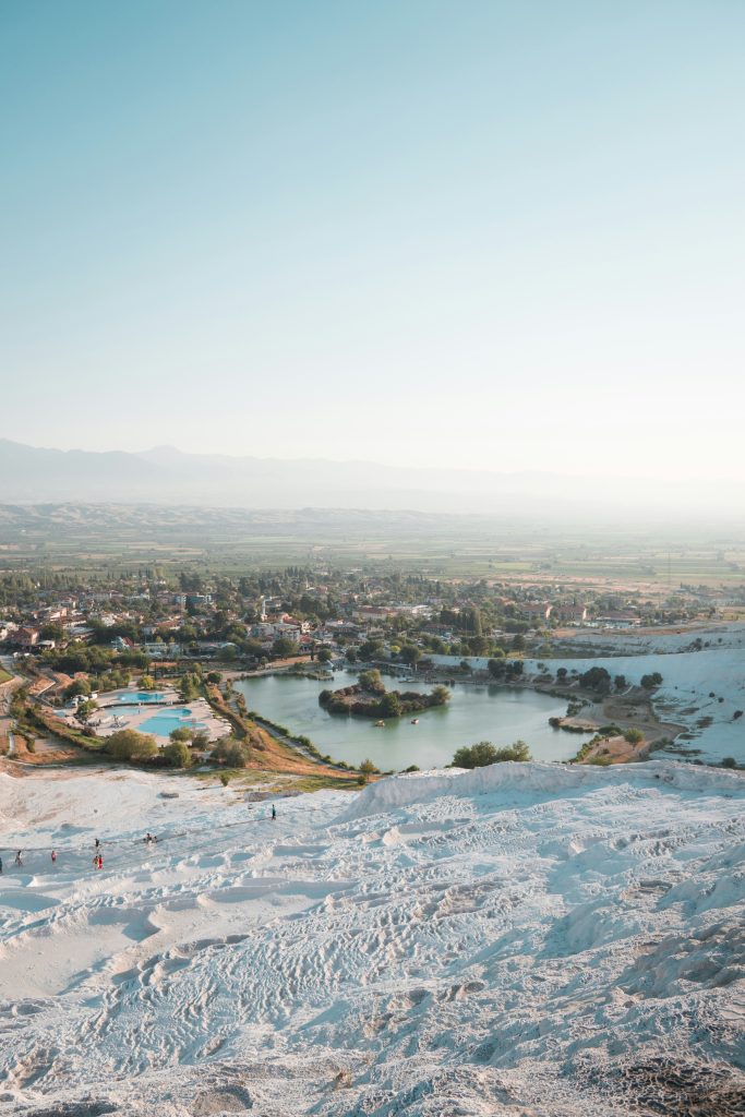 Scenic view from Pamukkale's travertine terraces across the Denizli countryside and surrounding hills