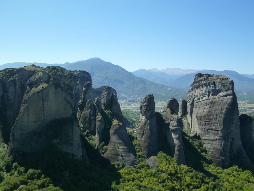 Spectacular aerial-style view of Meteora’s massive stone towers and surrounding valley in central Greece.