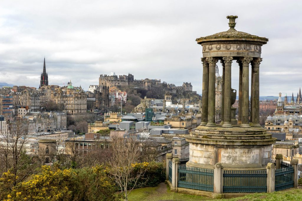 Monument overlooking the city skyline and historic landmarks