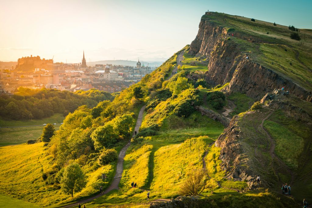 Scenic hiking trail with panoramic views over the city and surrounding hills