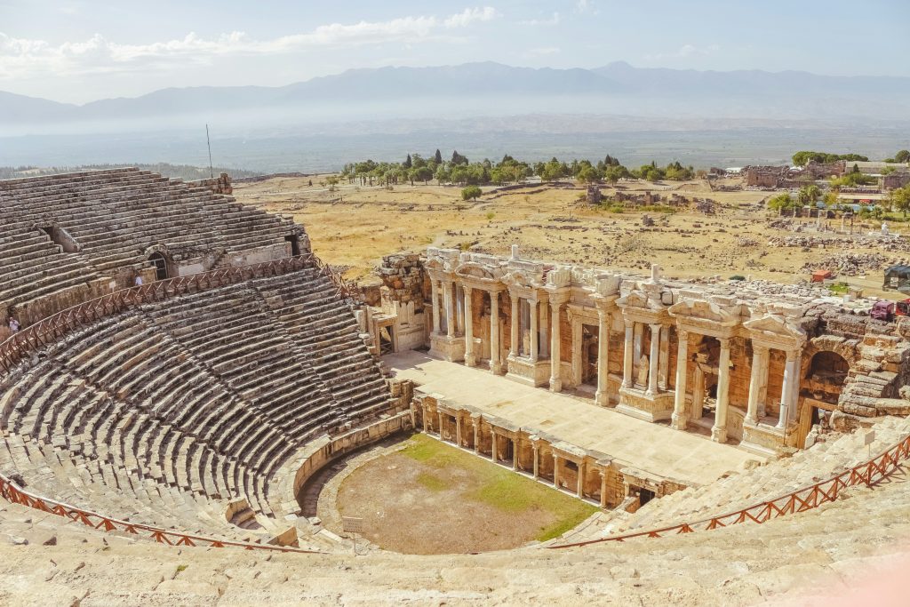 Historic Roman theatre in Hierapolis featuring impressive stone architecture and panoramic countryside views