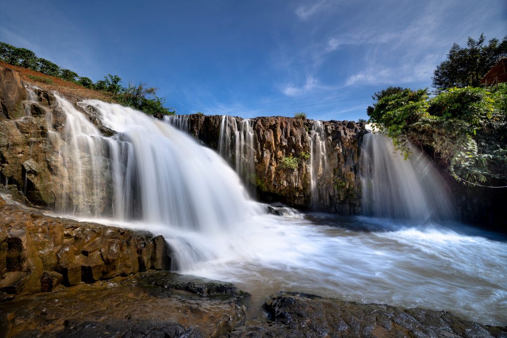 Rochester Falls surrounded by tropical greenery and volcanic cliffs