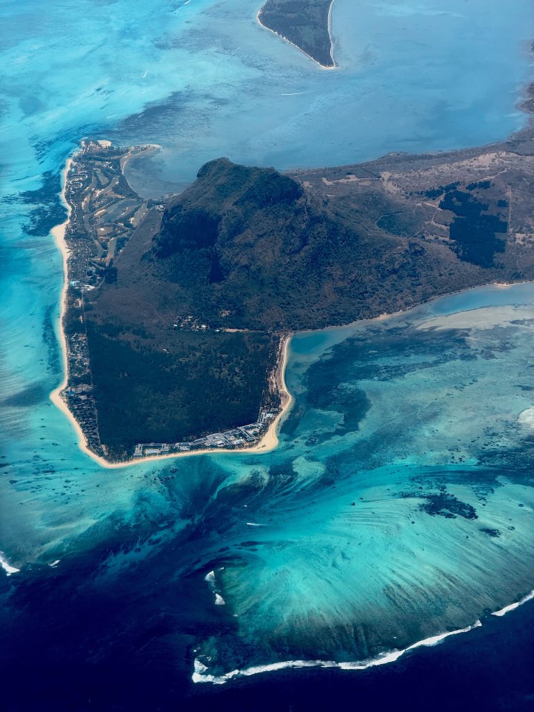 Le Morne Brabant rising above crystal-clear lagoons and tropical coastline