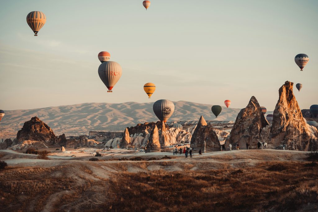 Sunrise hot air balloon flight over Cappadocia’s famous fairy chimney rock formations